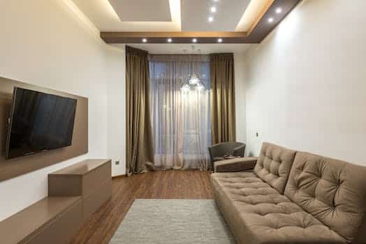 Room with TV Screen and Beige Furniture