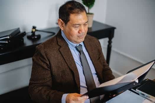 Pensive Asian lawyer examining report in office