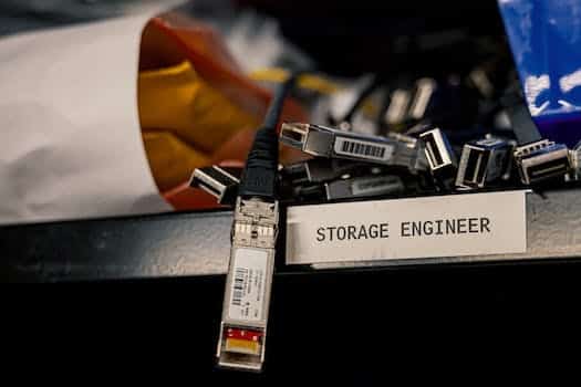 Low angle of various connectors and USB cables placed on shelf with storage engineer inscription